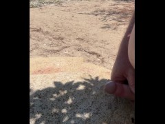 Naked wanking on a rock & cum