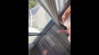 Young guy cums all over window!