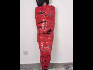NANA Mummified with Red Plastic Tape and then Played with for Orgasms