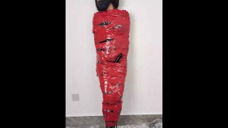 NANA Mummified with red plastic tape and then played with for orgasms