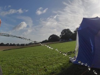 Pissing on a Camp Field in the Morning