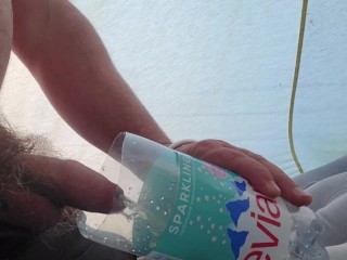 Pissing in a Bottle in a Tent while Camping