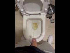 DUDE PISSING IN TOILET