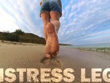 Barefoot Girl Walks Over The Summer Seashore