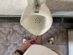 How do men pee in a urinal?