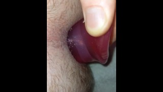 Close up view inserting and pulling out my xxl tunnel plug