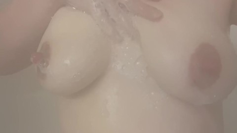 Soaping up my tits.