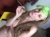 I smoke at home in an elegant headband, with bare breasts