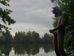 a young puppy decided to play with his dick by the lake