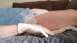 Relaxing And Voiding Through A Catheter After Filling The Bladder While Wearing A Diaper