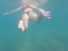 Aquatica's feet melted in the blue sea