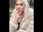 Preview 5 of A blondie teen Nina i sitting in the park smoking and spitting making a really big spit puddle