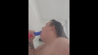 Sucking dildo in shower