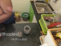 Nude girl dish wash in kitchen