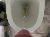 Man pissing in the office toilet, cock view in 4K