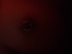 Putting rubber bands on my nipple piercings late at night (brightness up)