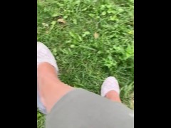 Feet dangling with shoes public. Shoe play outside