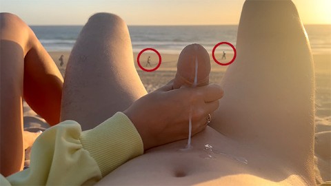 Public handjob. Hand job on a nude beach. We were caught jerking off at sunset near the ocean