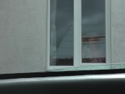 Preview 1 of Milf sexy blonde washes window apartment in dressing gown without panties and bra. Naked in public