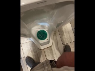 Taking a Leak in a Tall Urinal at a Gas Station