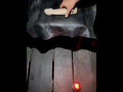 A master of polishing a wooden dildo