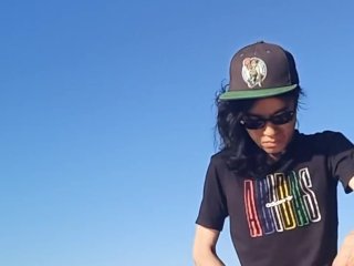 Risky public masturbation, cumshot outside, outdoors, by the water, of a twink with long black hair