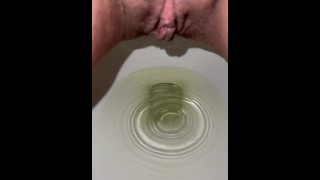 Up close slo-mo pissing