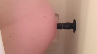 Trans man uses dildo to fuck ass in shower