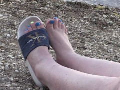 Women's legs in slippers.