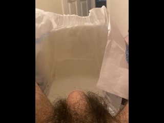 Diaper boy inserting butt plug