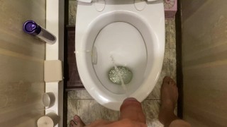 Barely managed to run, male pissing in the toilet