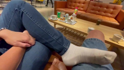 Dangling and shoeplay in white socks in the cafe
