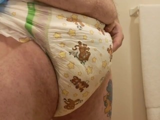 Putting new Diaper under Soggy one