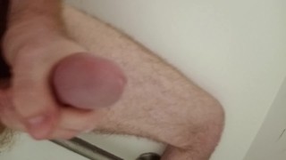 Watch me jerk my long cock in the shower and cum hard.