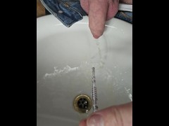Sounding rod with sprinkler head pissing with slow motion and foreskin