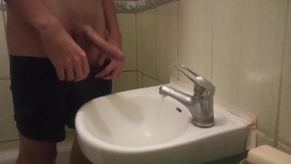 pissing my beautiful circumcised cock in the sink