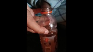 Peeing in a Gatorade bottle.