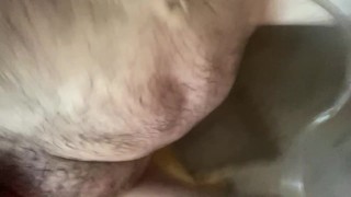 Viciously pumping cock in shower