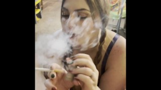 Sexy Smoker With Pigtails Eats Cum