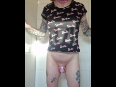 Sissy shows buttplug and pisses from her cage