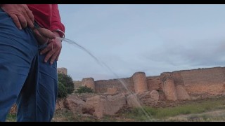 Pissing by medieval castle