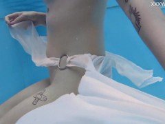 Finnish babe swims nude in the pool