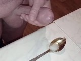 the wife excited her husband with a blowjob. the husband jerked off and finished in a spoon.