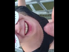 Rude risky pissing in mouth on public bridge and spitting into river