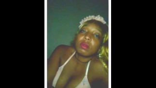 Ebony Goddess blowing smoke into camera with full red lips