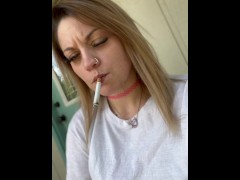 Hot babe dangling her morning cigarette