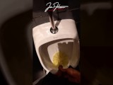 This handsome boy pisses pee in a public urinal in a crowded restaurant. Jon Arteen gay porn video