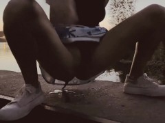 Petite blonde pissing in public near Vistula river in Warsaw