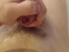 the young guy peed on himself and then started jerking off