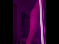 Guy fucks dildo in mirror while rolling on molly blacklight